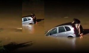 Temporal: Vídeo mostra motorista preso em carro submerso, escapando após quebrar o vidro do porta-malas